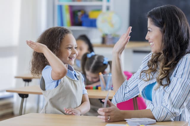 Student giving high five